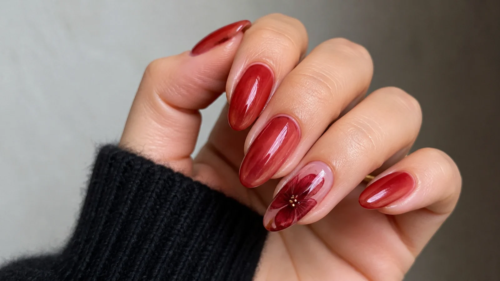 Sheer red nails with one crimson blooming gel blossom accent nail