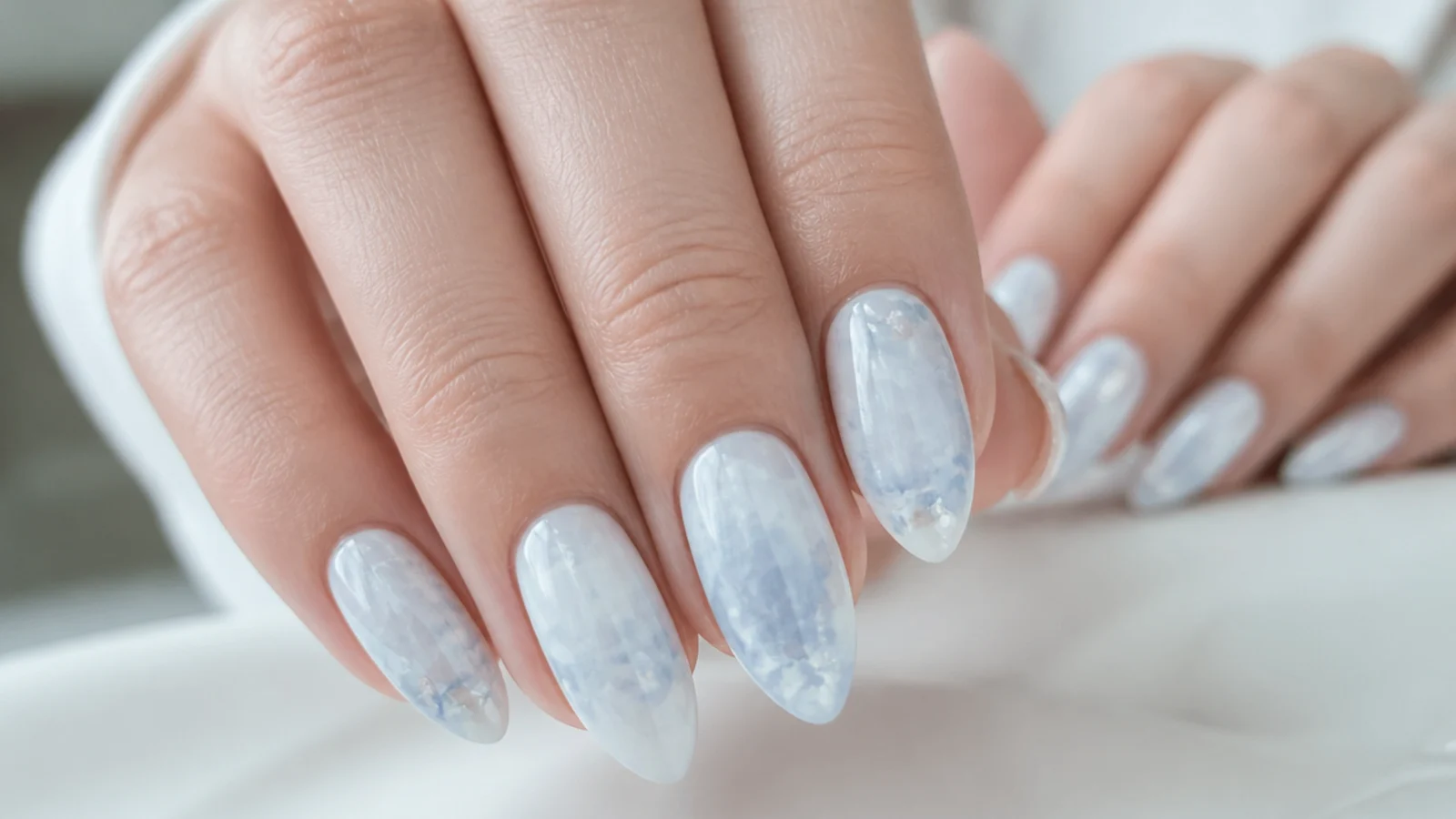 Icy blue-white marble blooming gel nails