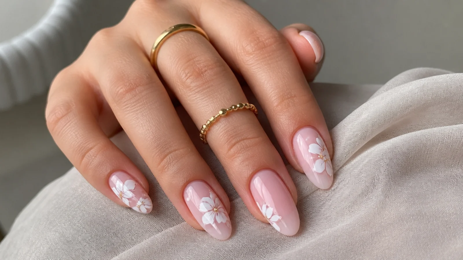 White blooming gel flowers over a sheer pink base