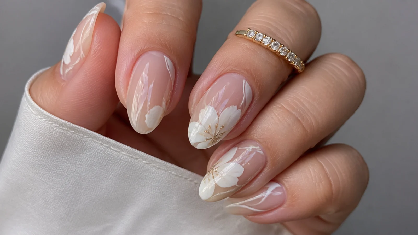Modern white abstract blooming gel nails with soft shapes