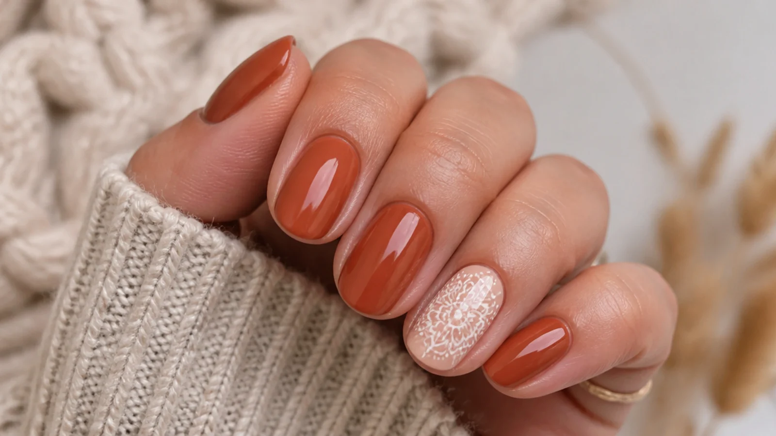 Terracotta boho fall nails with a fine cream mandala accent nail