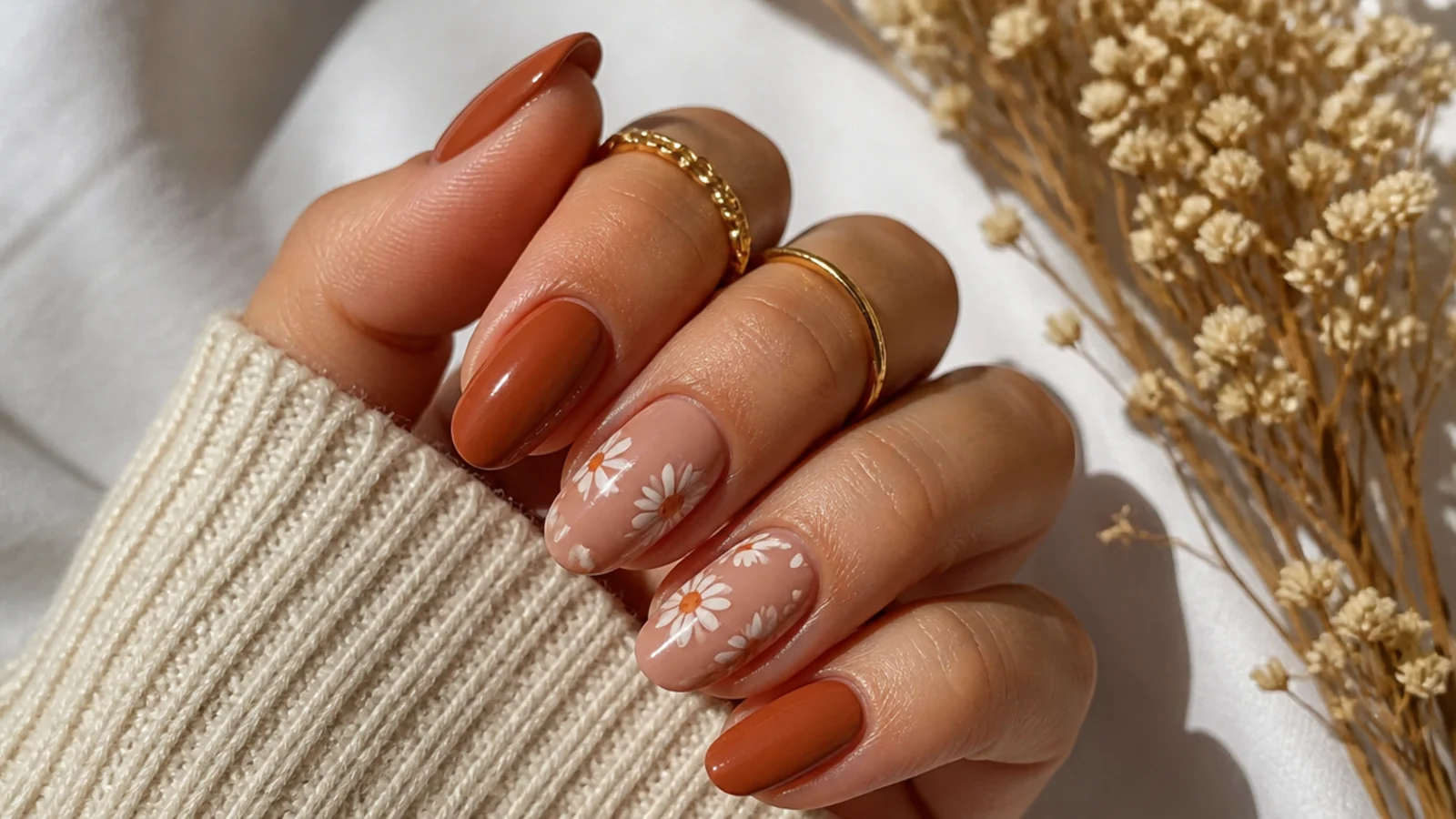 Terracotta boho nails with small cream daisy accents