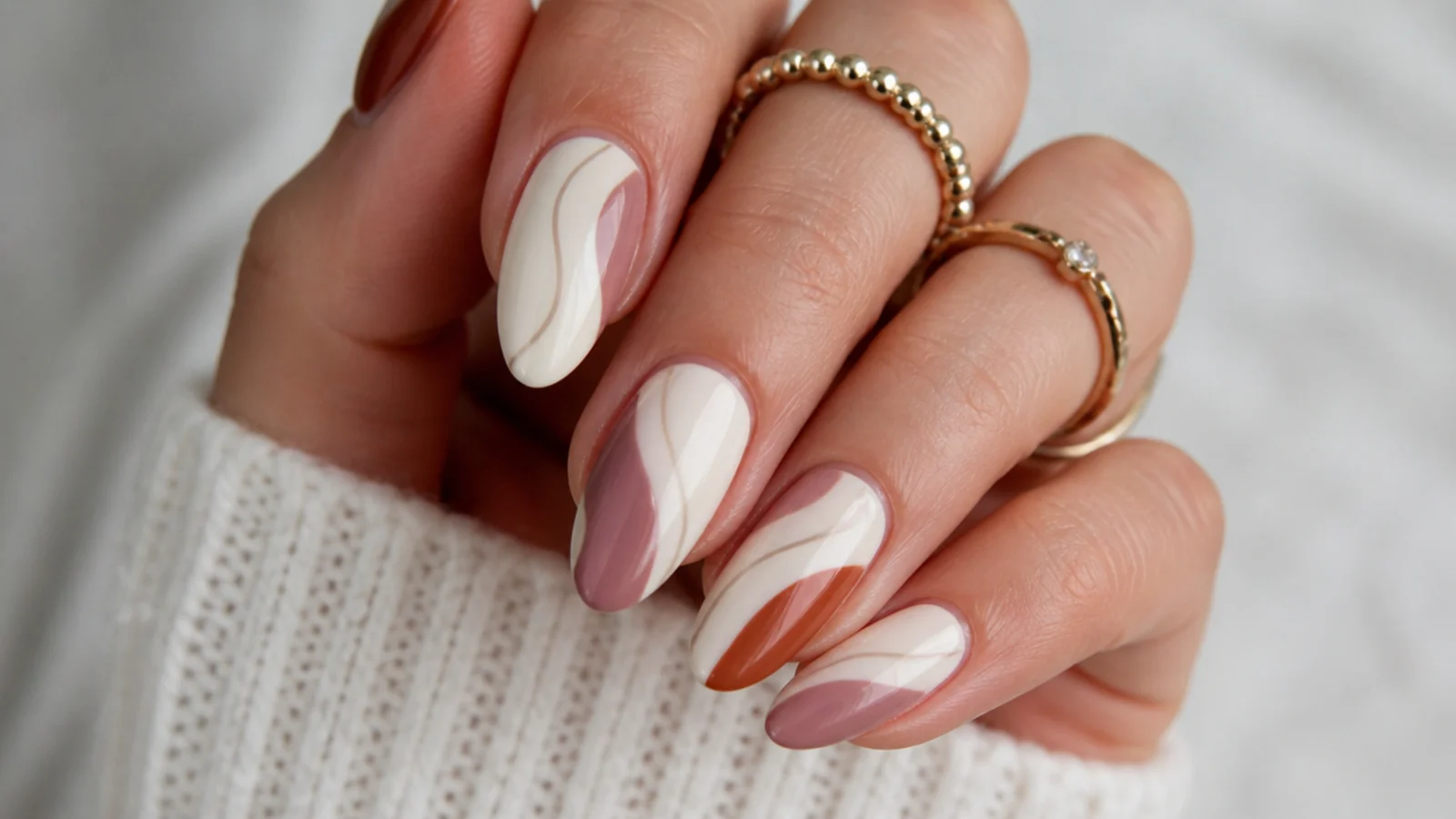 Cream boho nails with muted mauve and rust abstract swirls