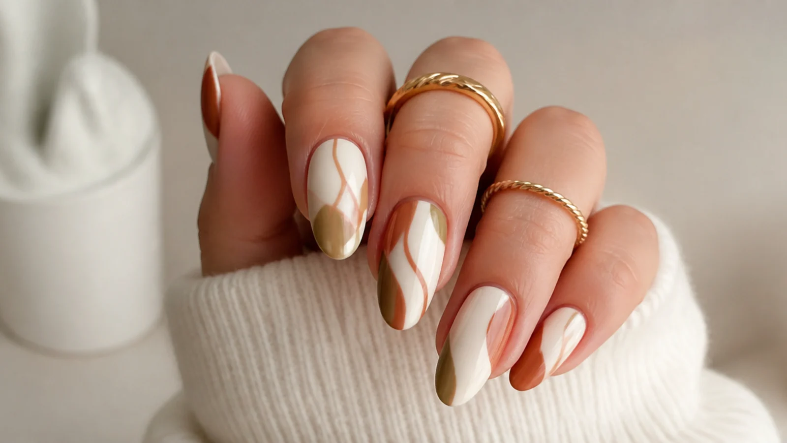 Cream boho nails with rust and olive abstract swirl lines