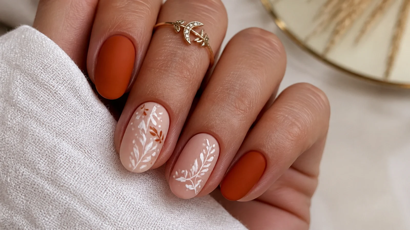 Warm terracotta matte boho wedding nails on short almond shapes