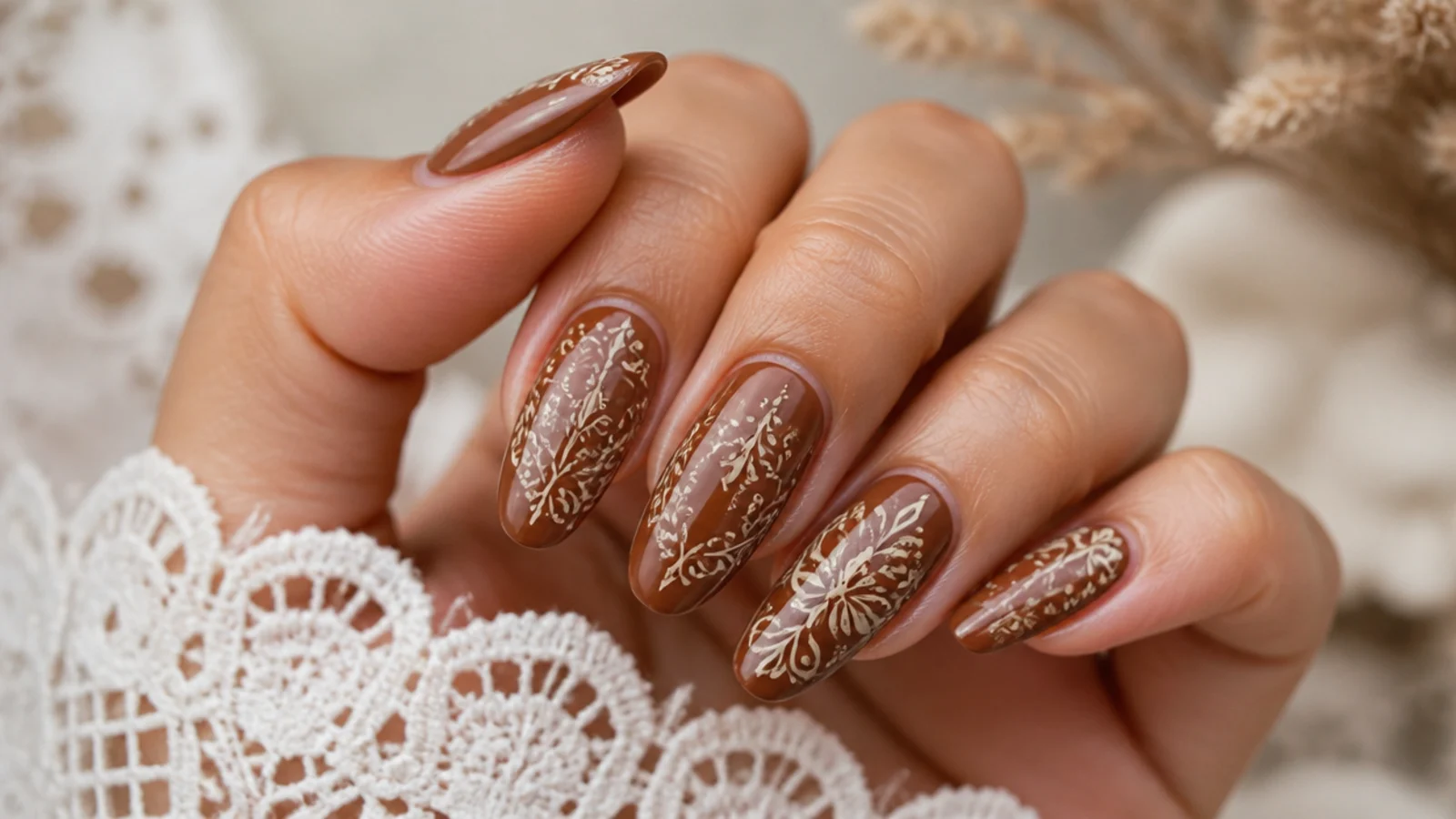 Warm brown boho wedding nails with fine cream tooled-leather line detail