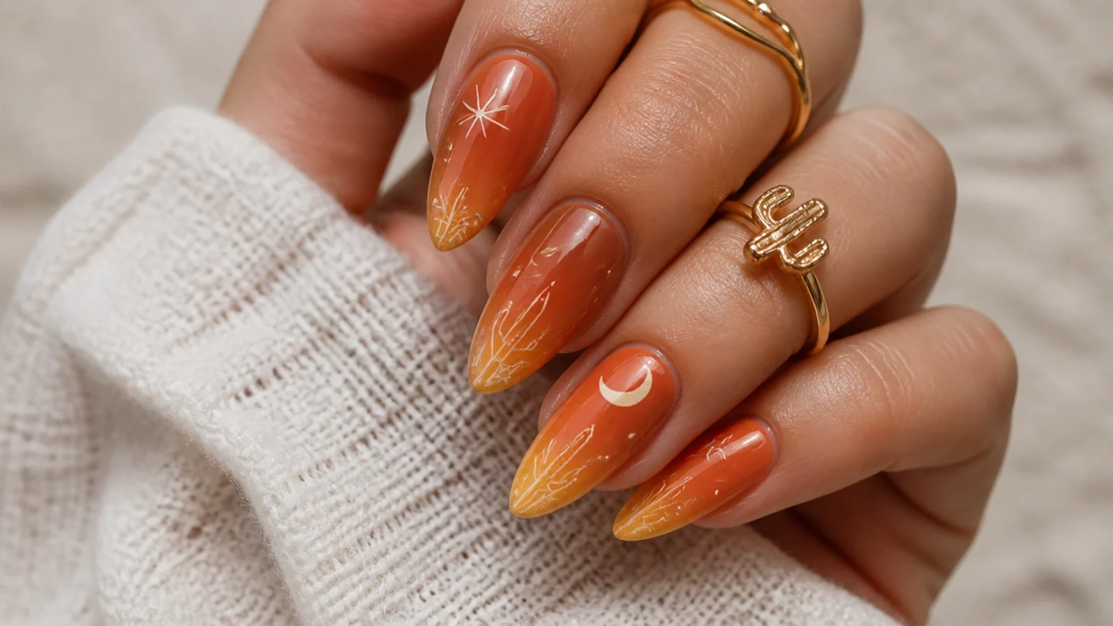 Warm ombre boho western nails fading from rust to muted gold