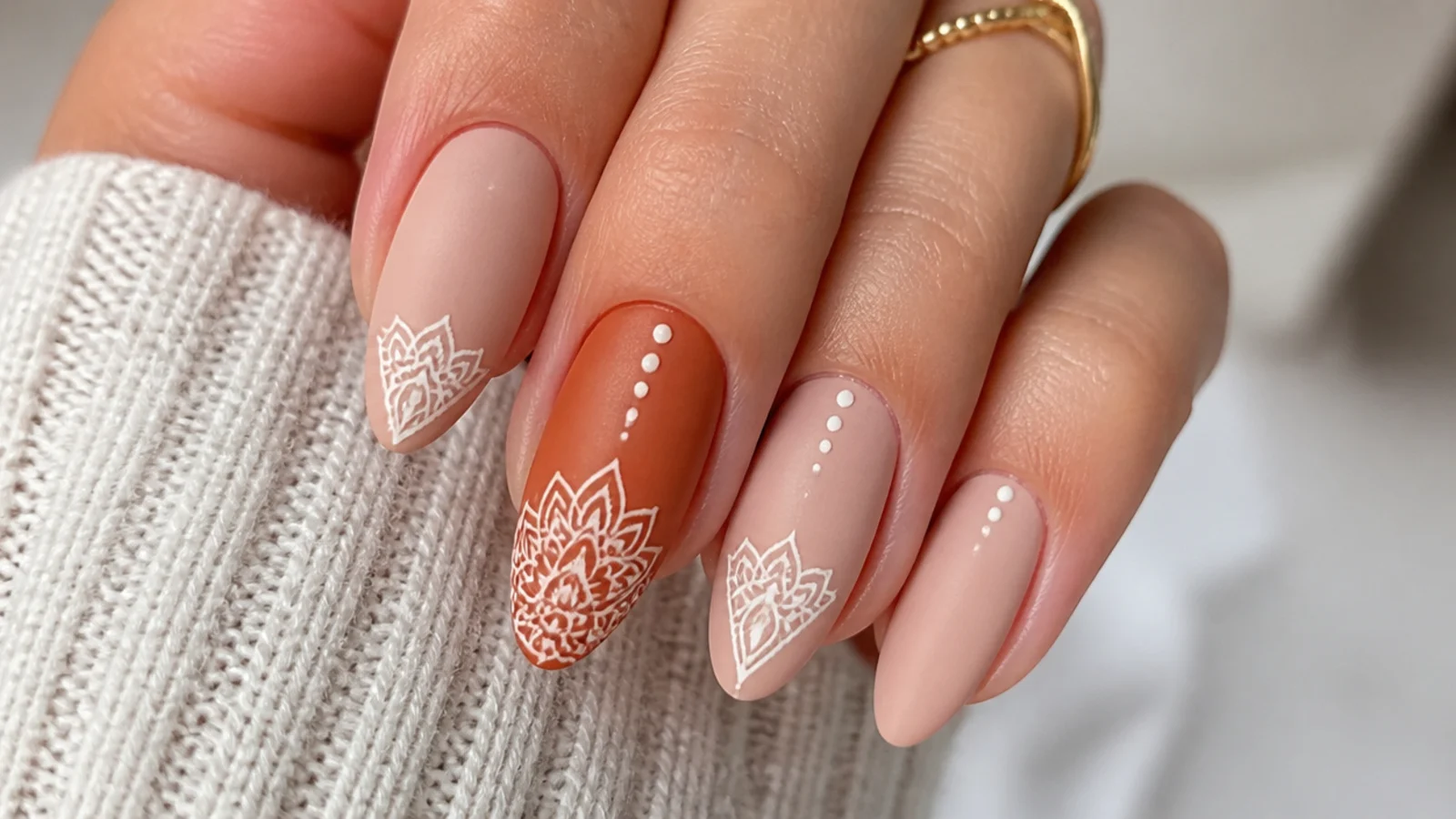 Fine white lace mandala boho nails on a terracotta accent nail