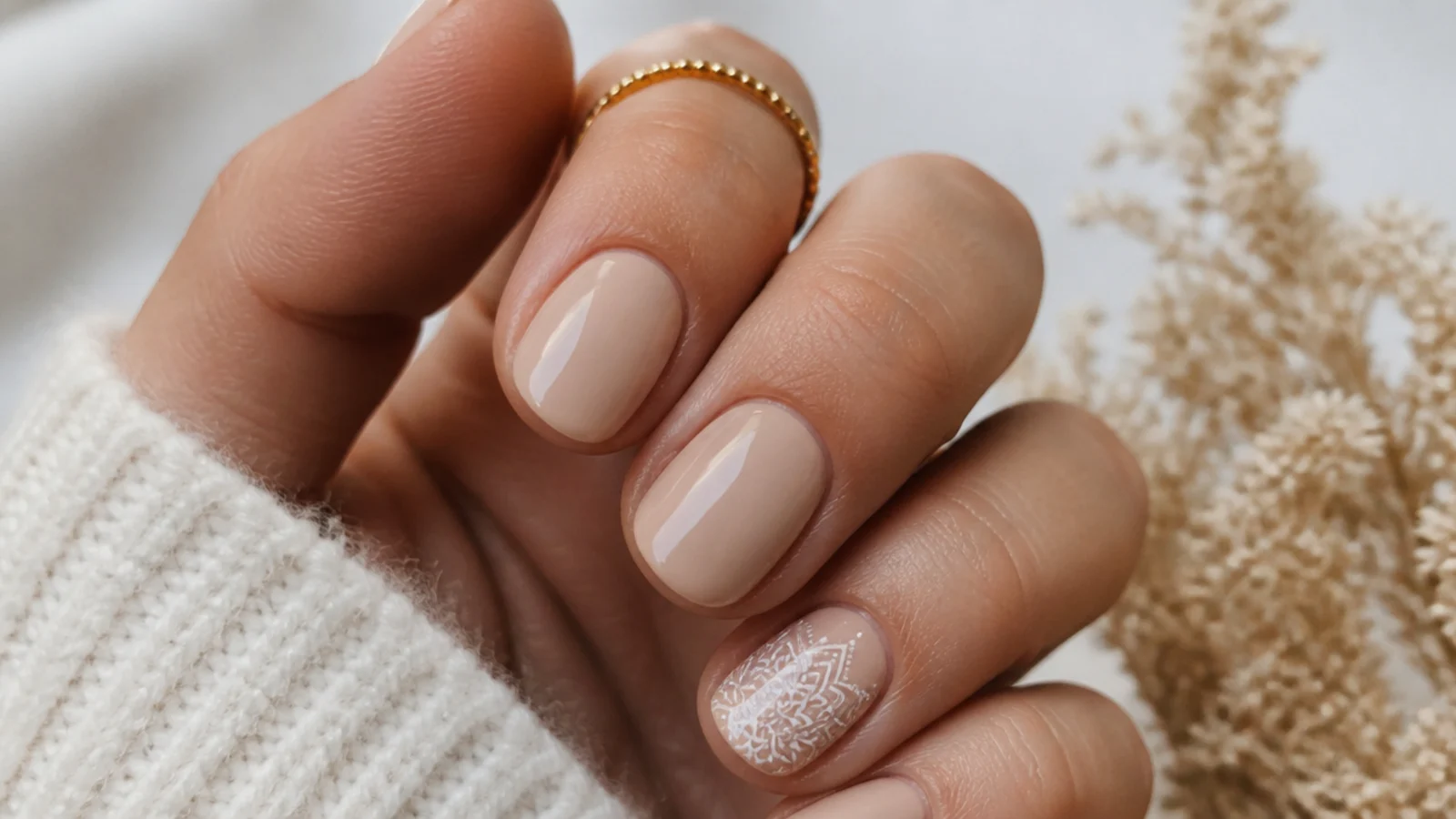 Short nude boho nails with one fine white mandala accent nail