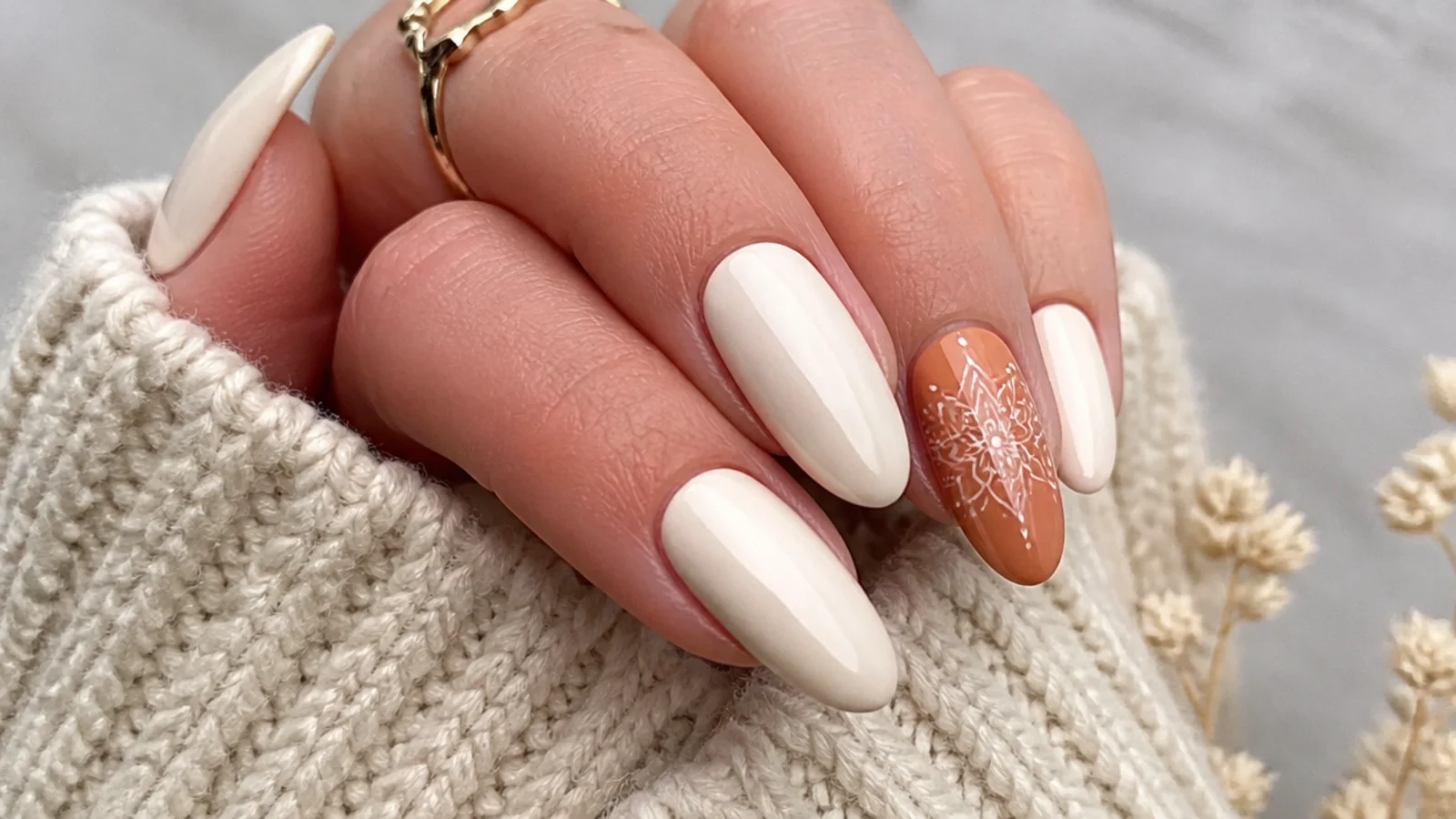 Cream boho nails with one fine white mandala on a terracotta accent nail
