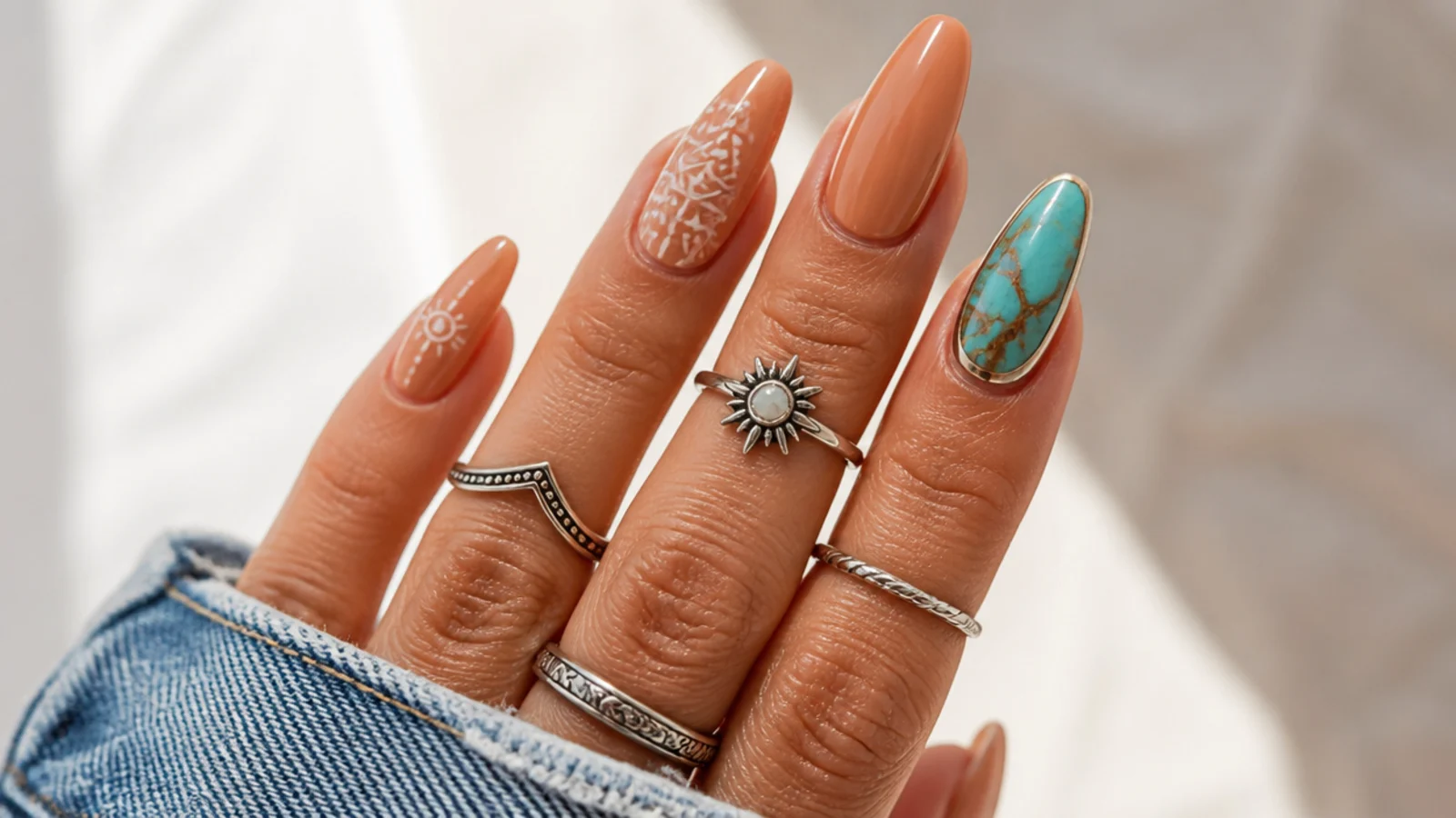 Tan boho nails with a turquoise stone effect accent nail