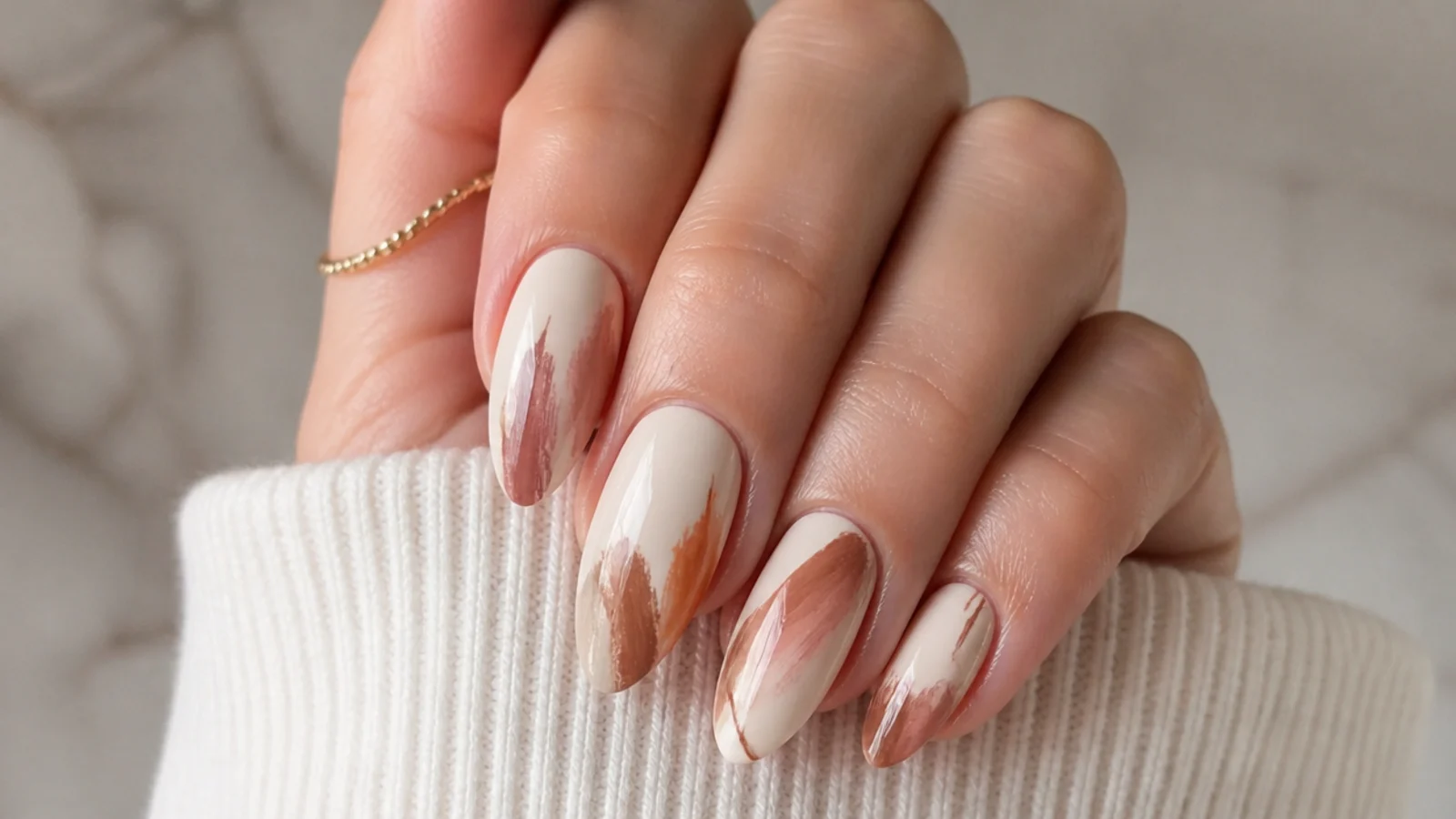 Cream boho nails with loose rust and brown abstract brushstrokes