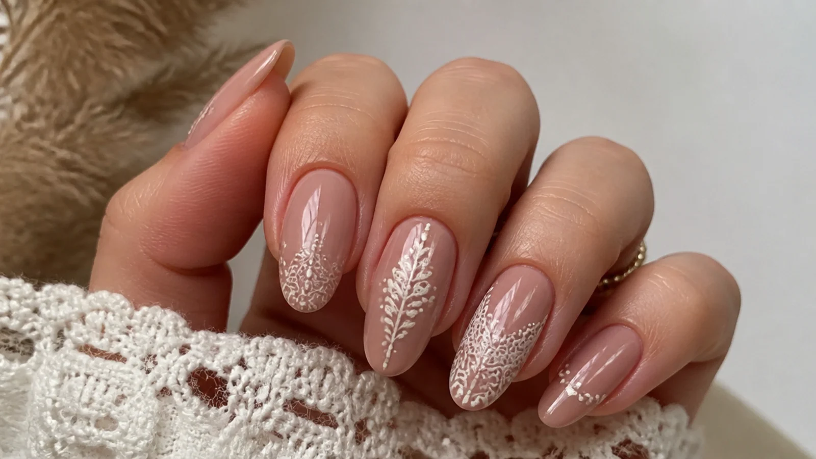 Nude boho nails with fine cream lace and dot detailing