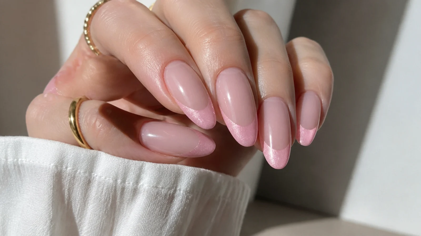 Almond nails with a soft pink magnetic cat eye french tip