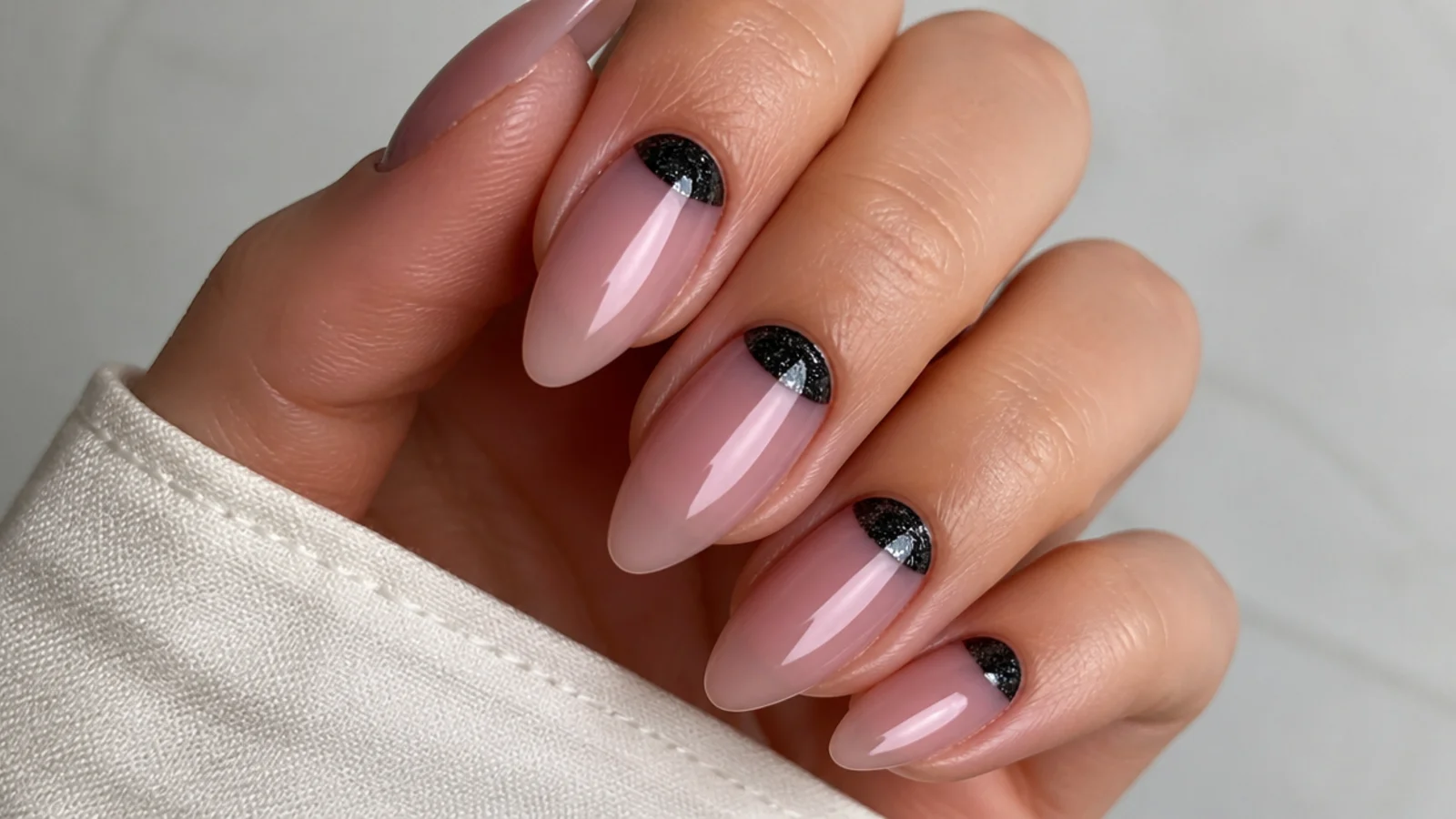 Black cat eye half-moon french nails with the stripe at the cuticle