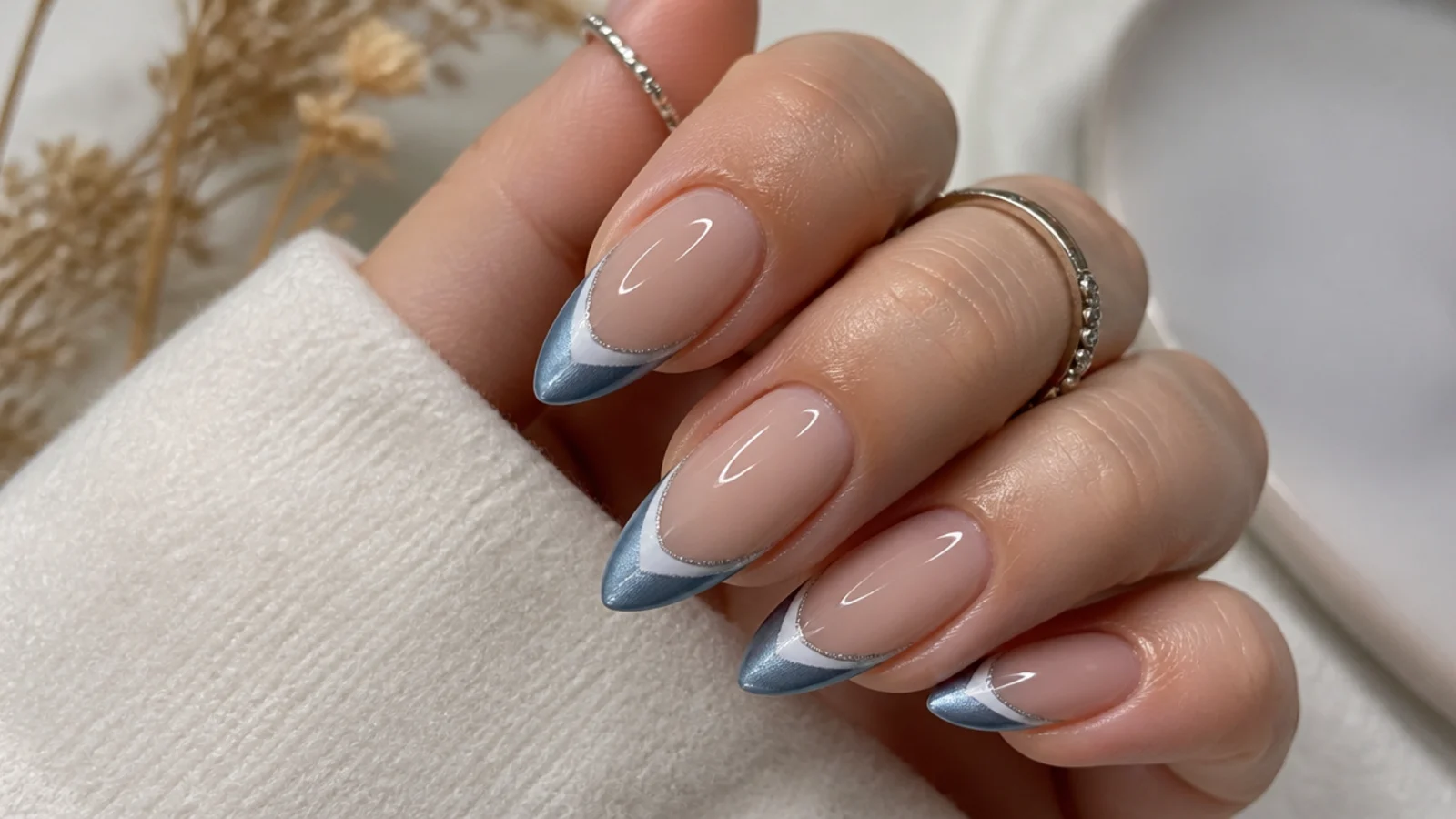 Cool steel blue-gray cat eye french tip nails with a metallic light stripe