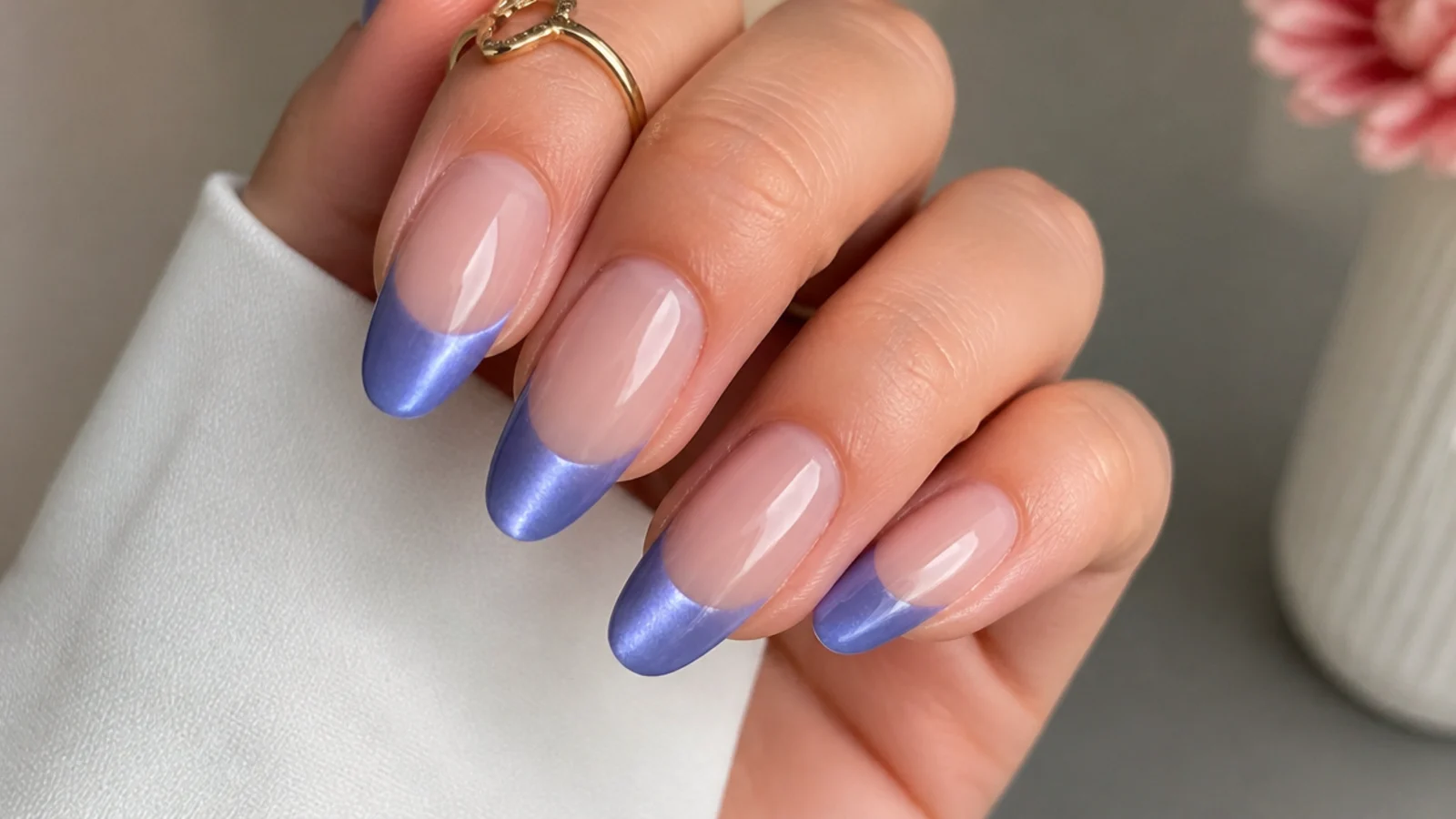 Soft periwinkle blue-purple cat eye french tip nails with a gentle light stripe
