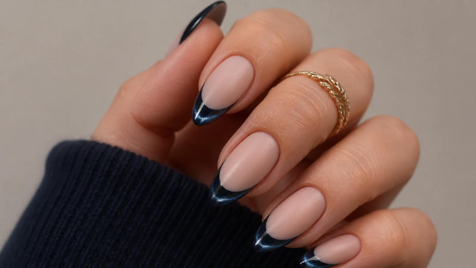 Matte navy cat eye french tips where only the light stripe stays glossy