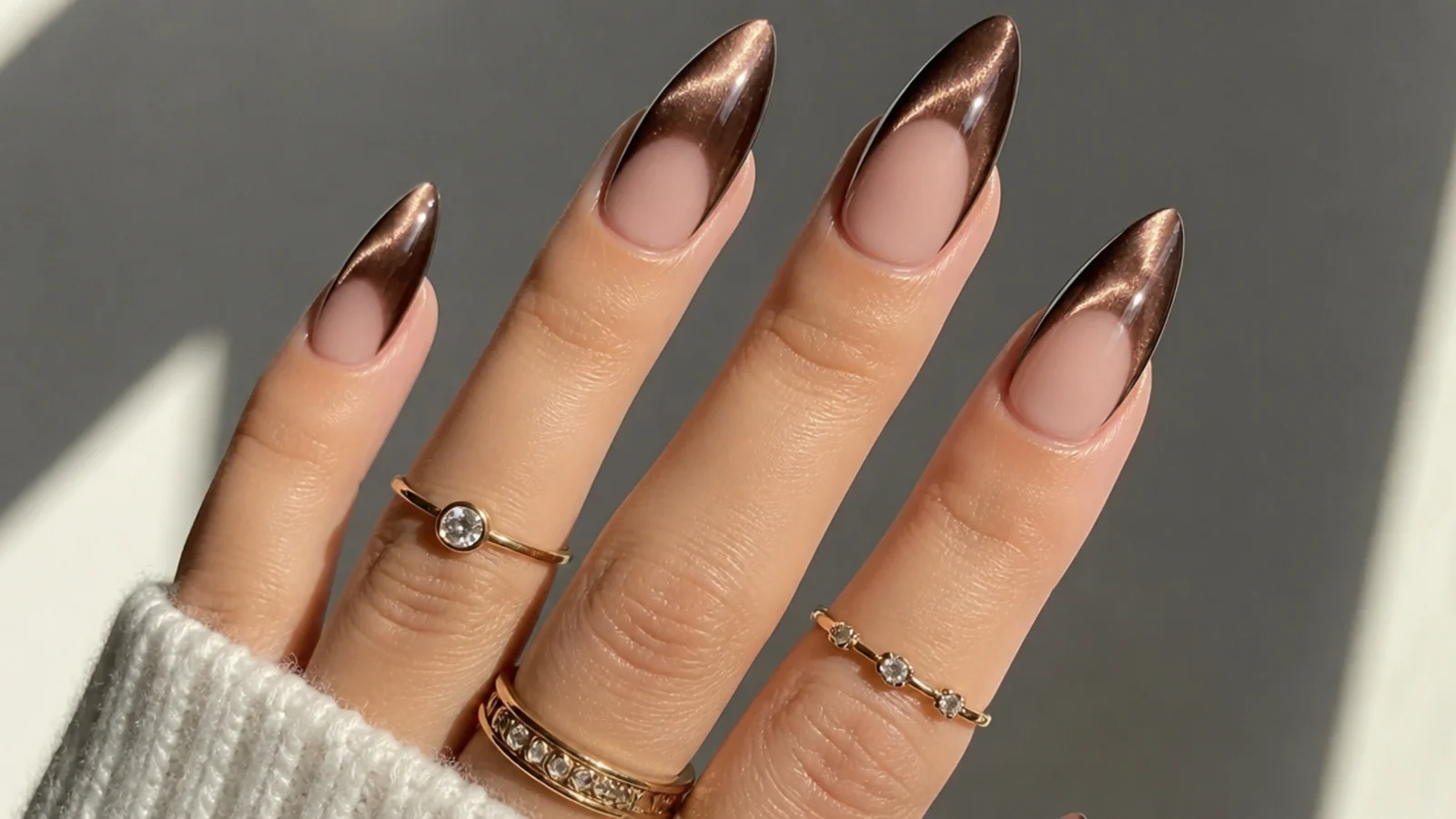 Deep espresso brown cat eye french tip nails with a bright center stripe