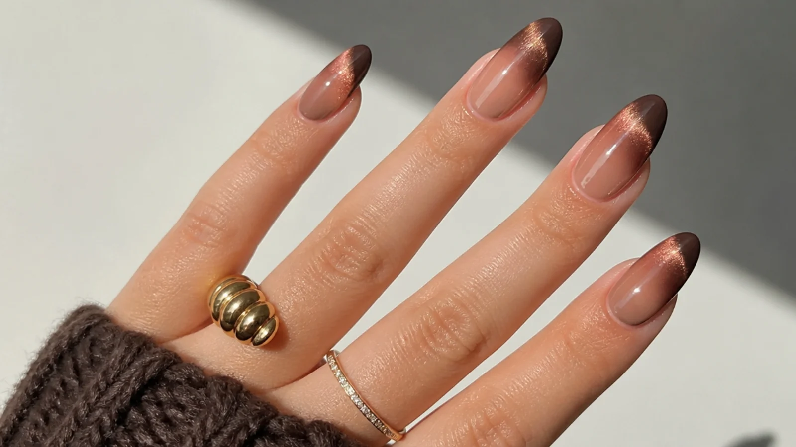 Matte cocoa brown cat eye french tips with a soft interior glow