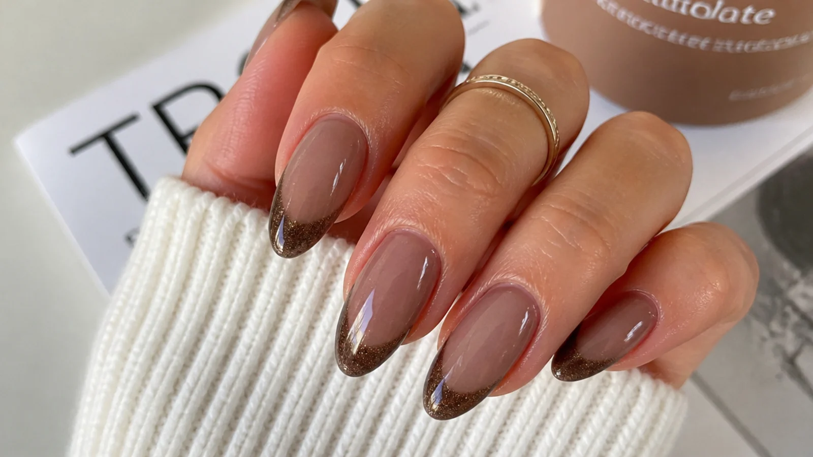 Warm mocha brown magnetic cat eye french tip nails on almond shape