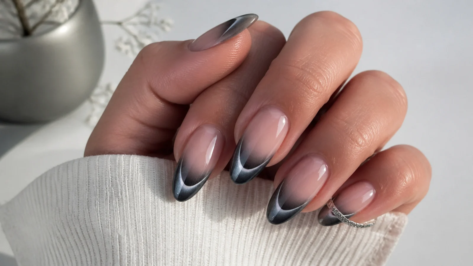 Cool gunmetal gray magnetic cat eye french tip nails with a steel light stripe