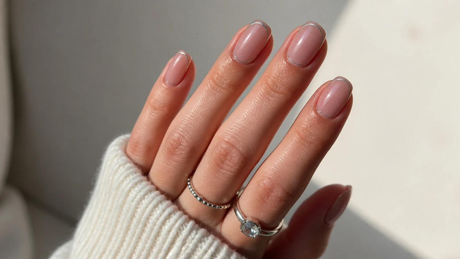 Very thin magnetic cat eye french tip with a fine light line on short almond nails