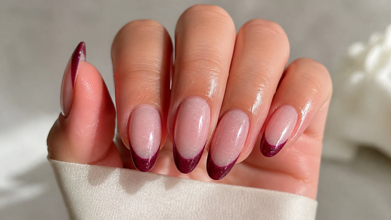 A well-sealed cat eye french tip manicure with cuticle oil for longevity
