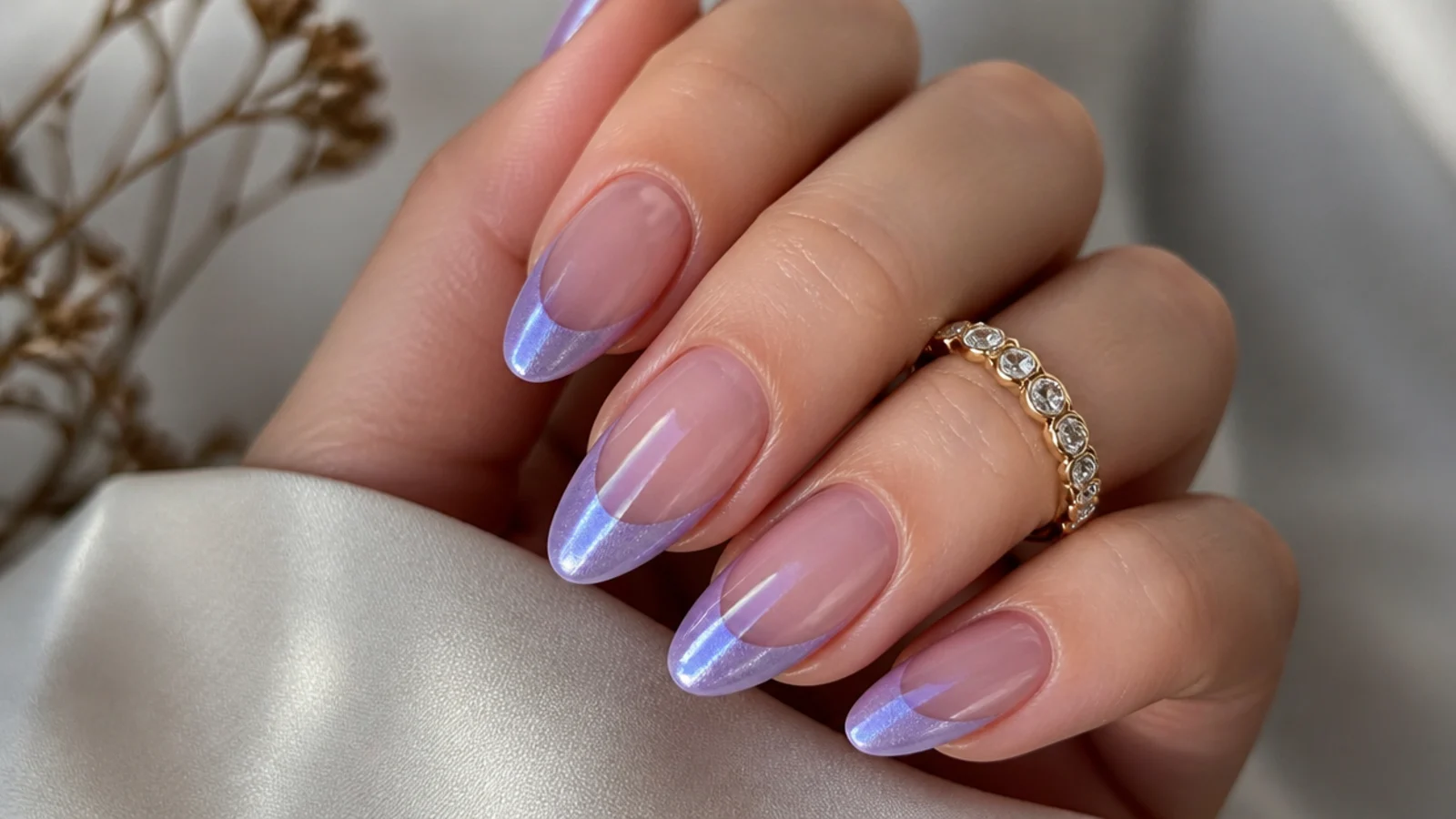 Lavender chrome cat eye french tip nails with a soft metallic light band