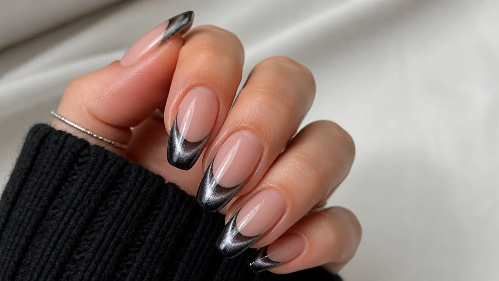Black chrome cat eye french tip nails with a silver mirror light band