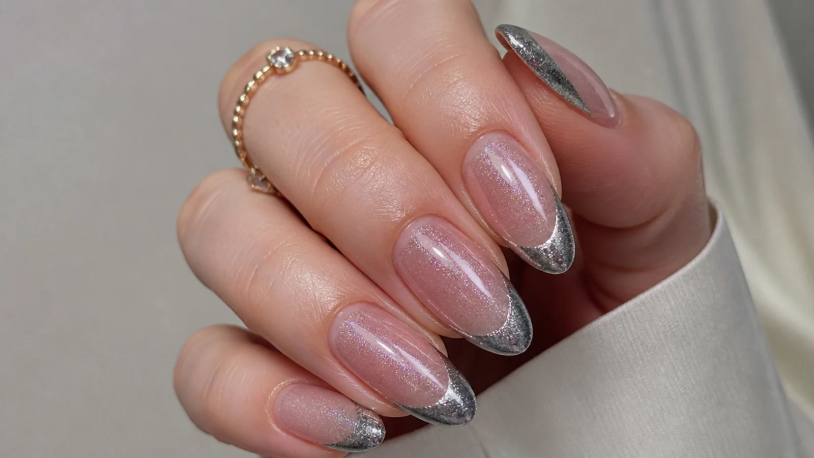 A well-sealed chrome cat eye french manicure with cuticle oil for longevity