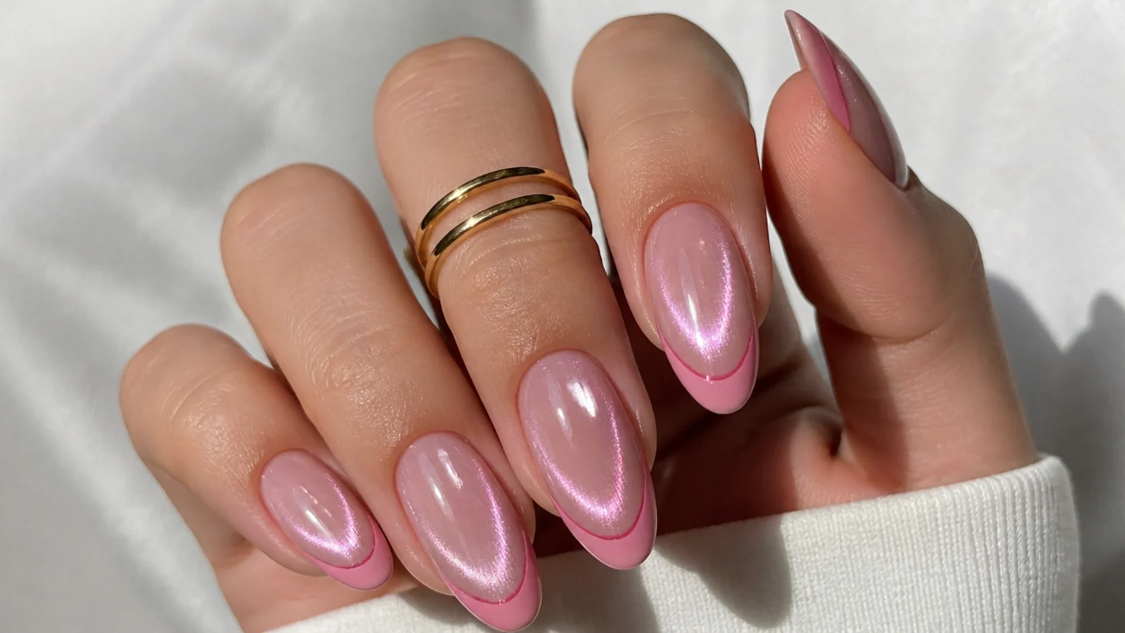 Pink chrome cat eye french tip nails with a mirror-like magnetic stripe