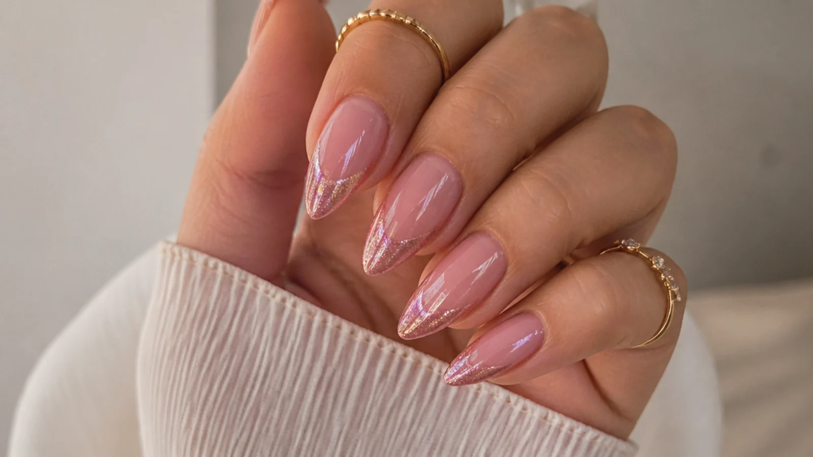 Pink glitter cat eye french tip nails with a sparkling magnetic stripe