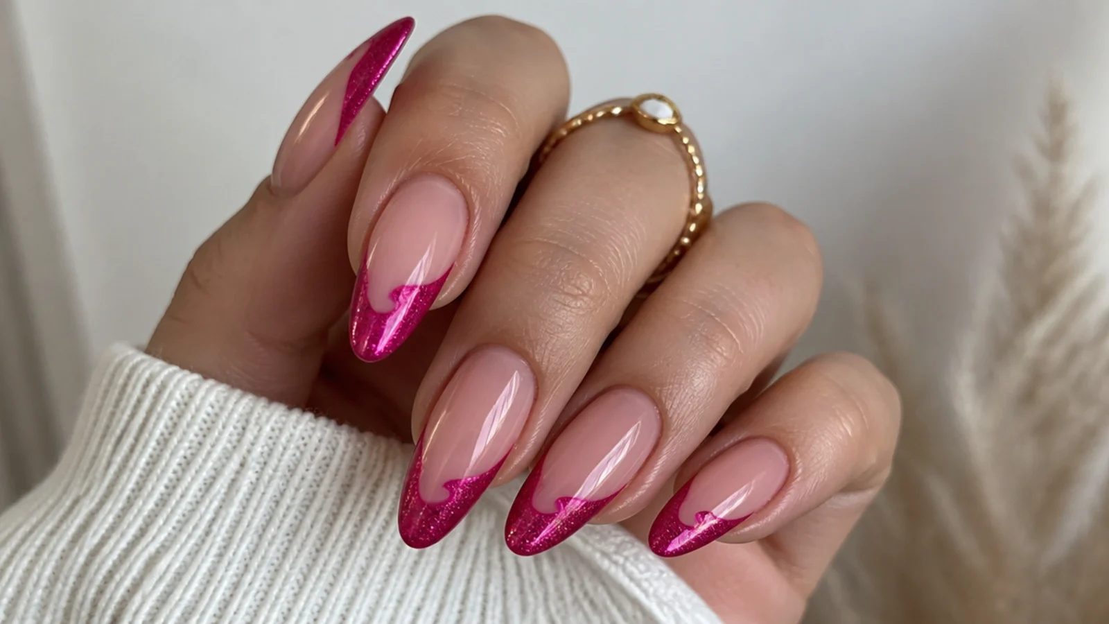 Bright fuchsia cat eye french tip nails with a vivid magnetic light band