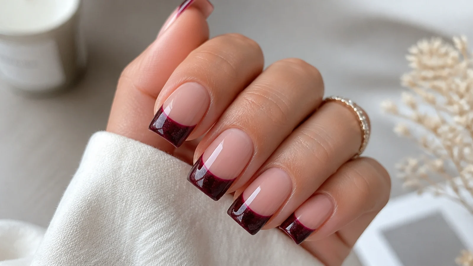 Square nails with a deep burgundy wine magnetic cat eye french tip