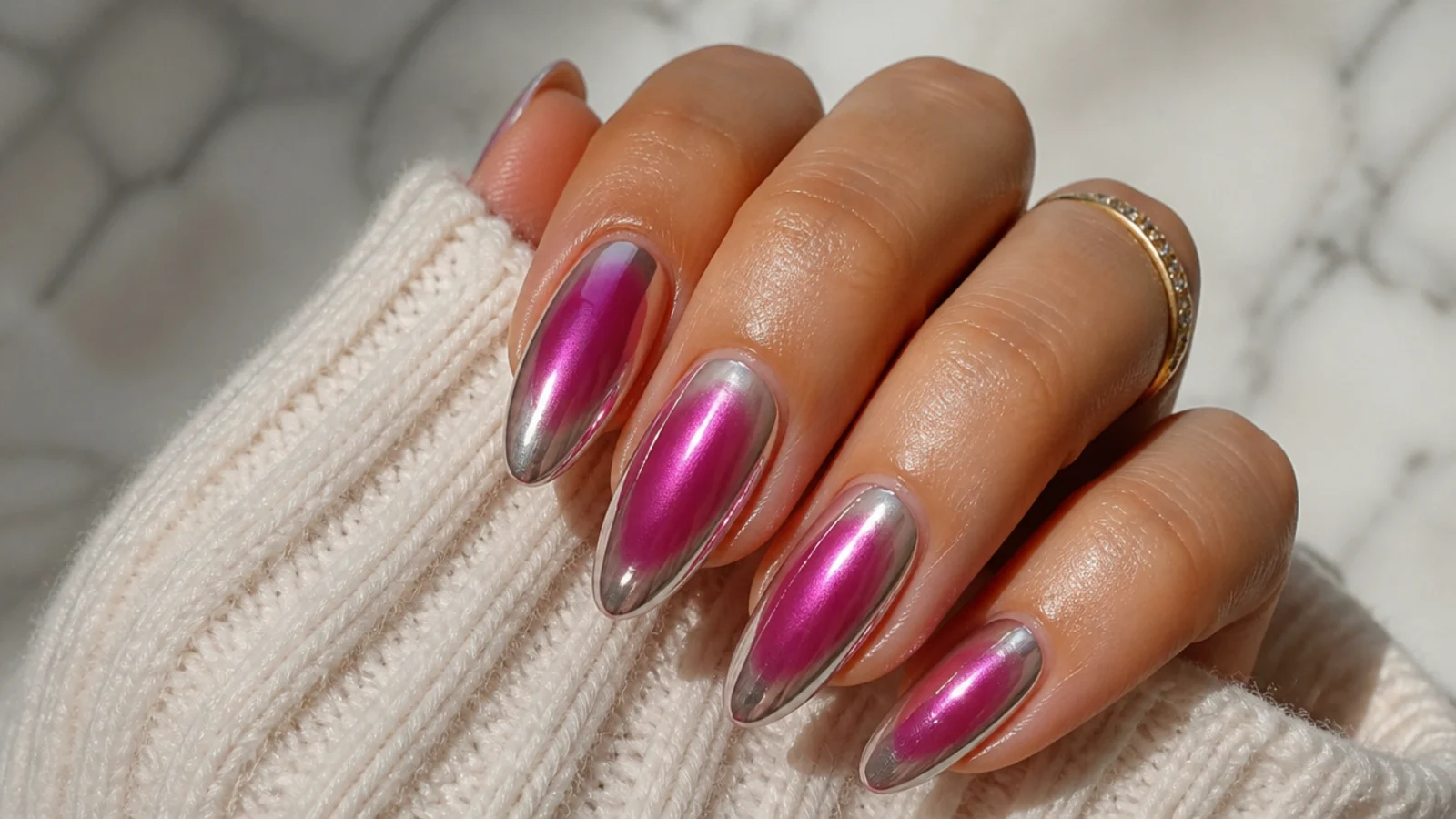 Long almond prom nails with a magenta aura halo under a silver chrome glaze