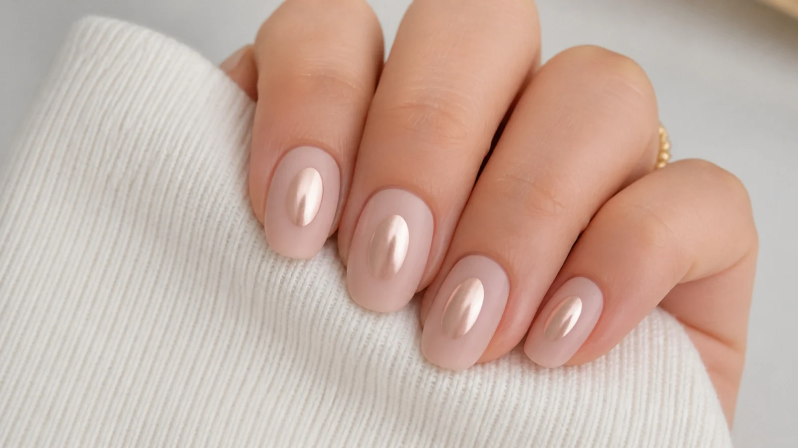Oval nails with chrome concentrated in a halo at the center and a bare matte surround