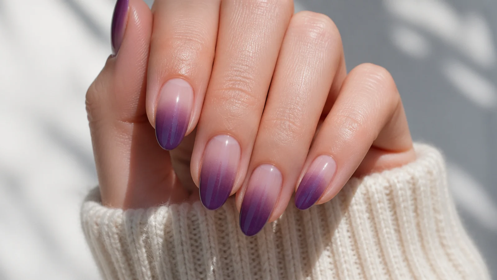 Sheer nails with a deep purple aura blurring outward from the tip instead of the center