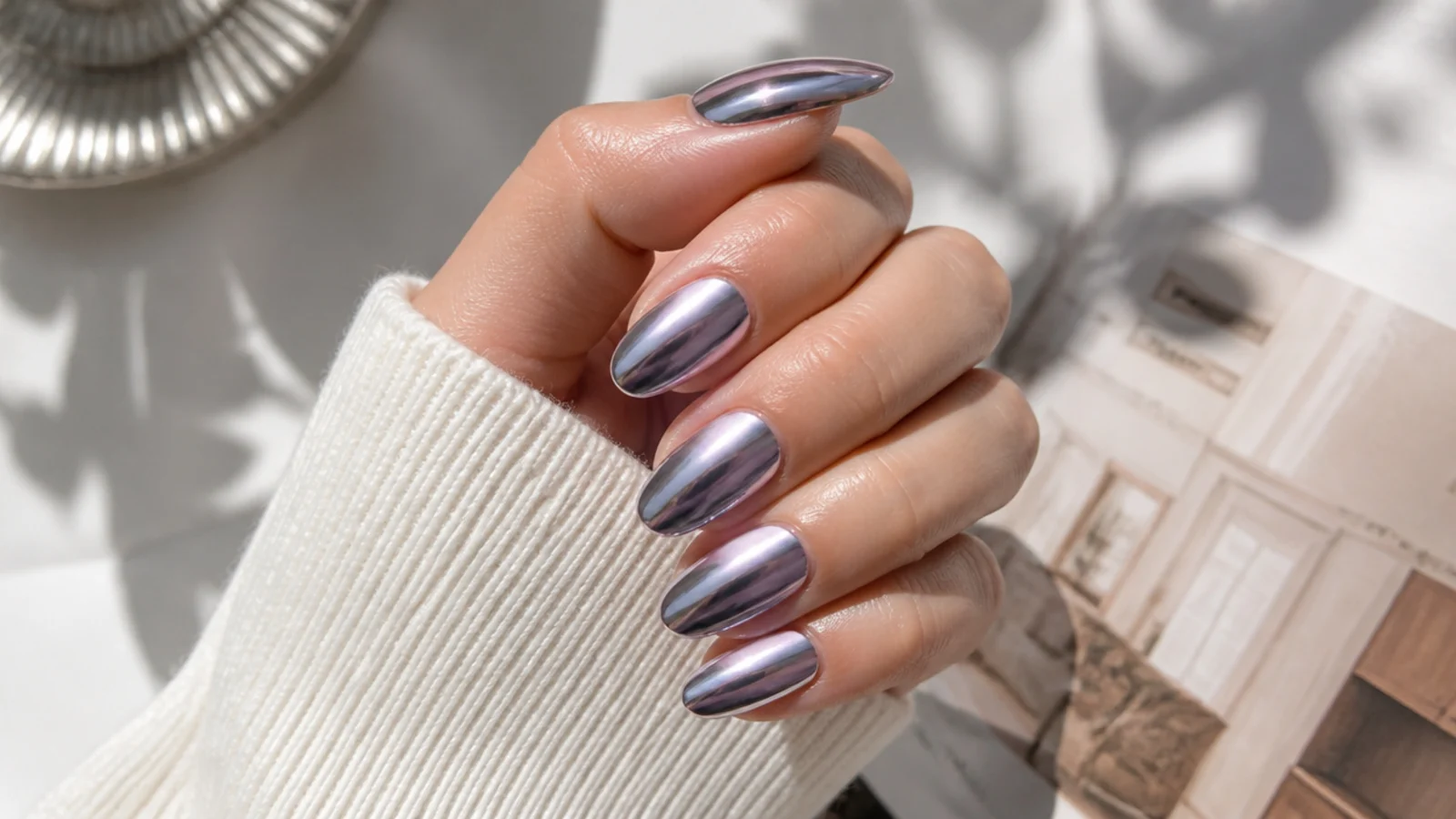 Dark purple aura nails under full silver chrome giving a sharp liquid mirror finish