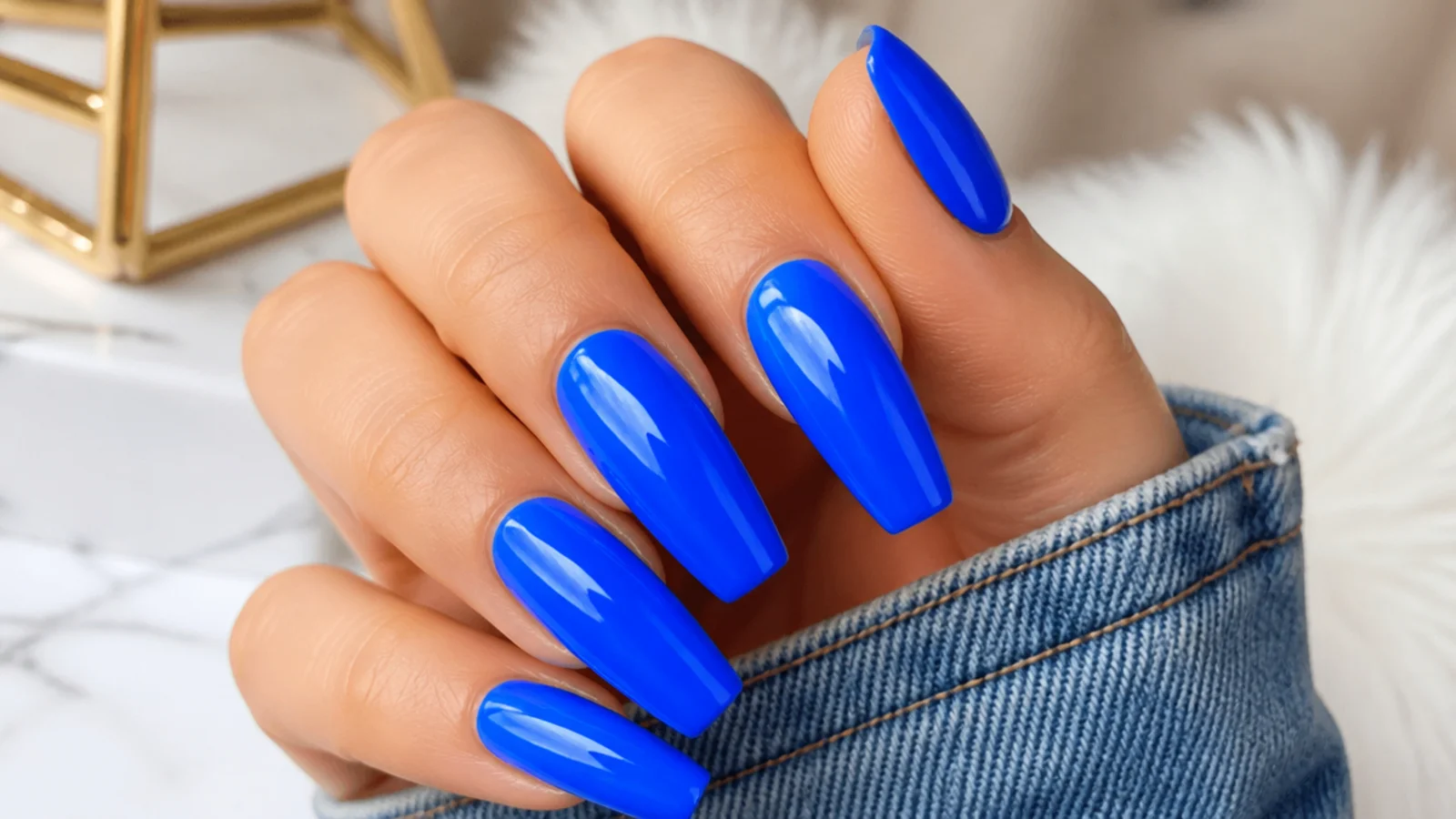 Electric neon blue coffin nails on long extensions with a glass finish