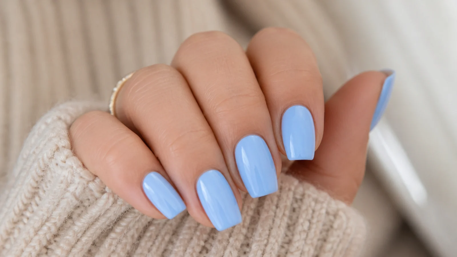 Soft baby blue coffin nails at short length with a clean glossy finish