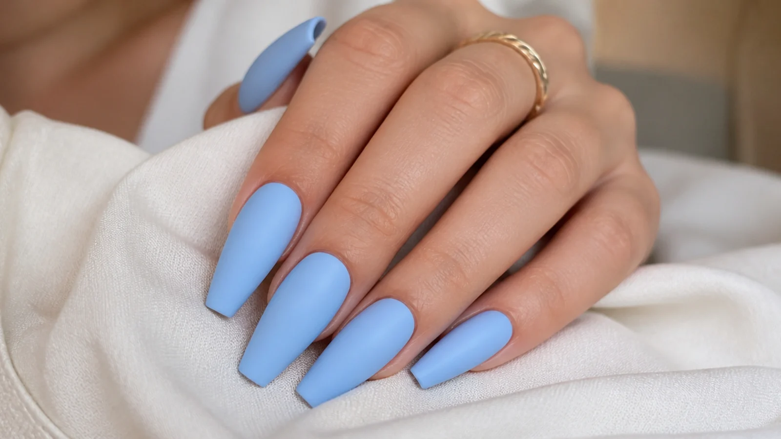 Powder blue matte coffin nails with a soft chalky suede finish