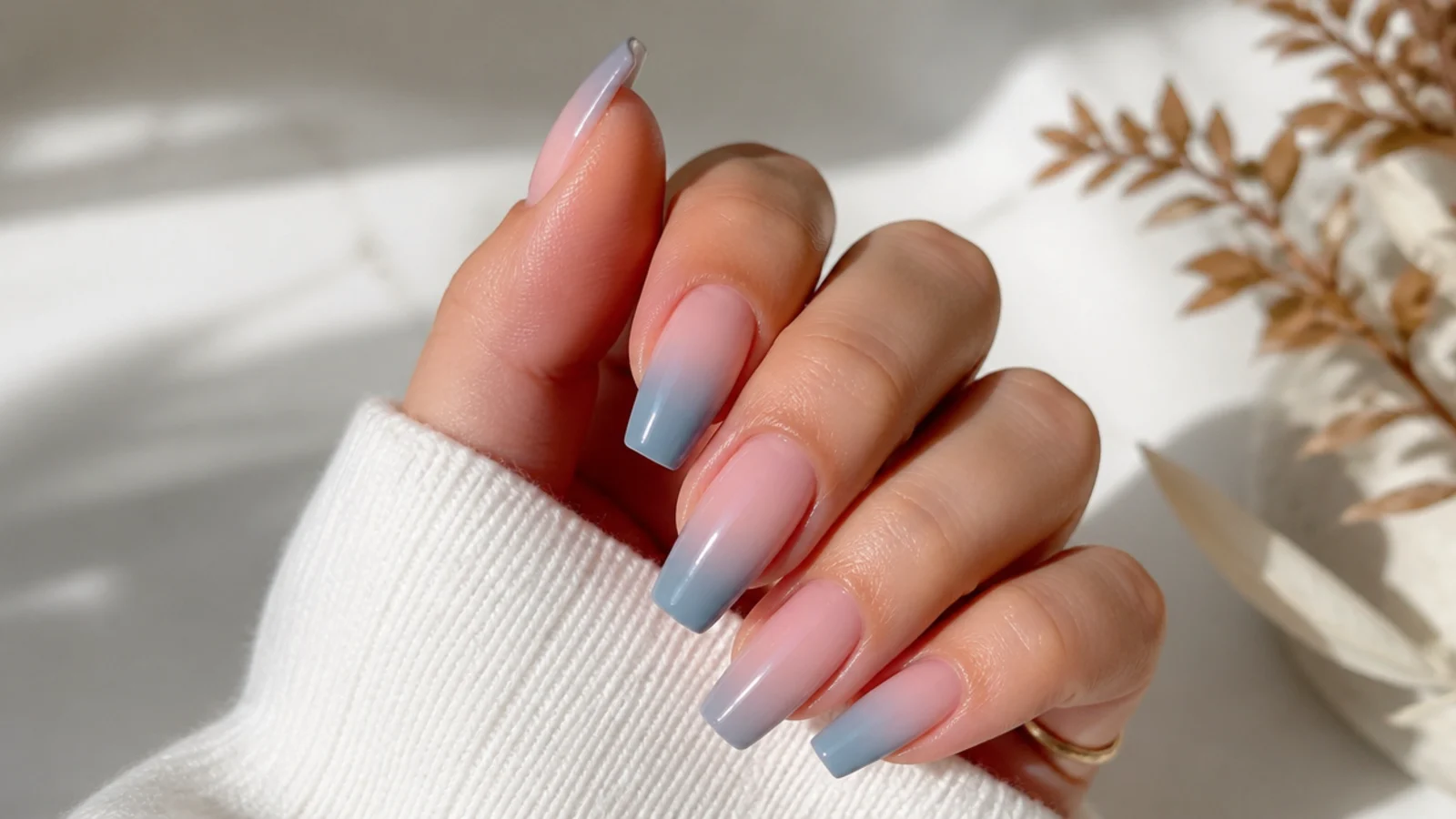 Nude to blue ombre coffin nails fading from bare cuticle to blue tips