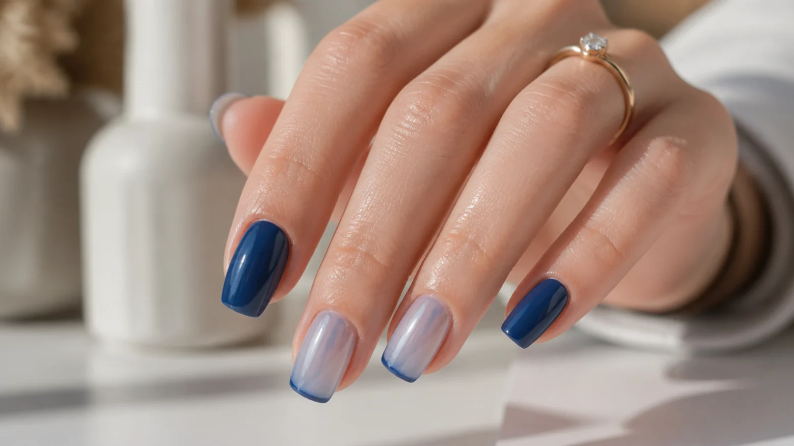 Short navy and sheer blue coffin nails styled for a workplace setting