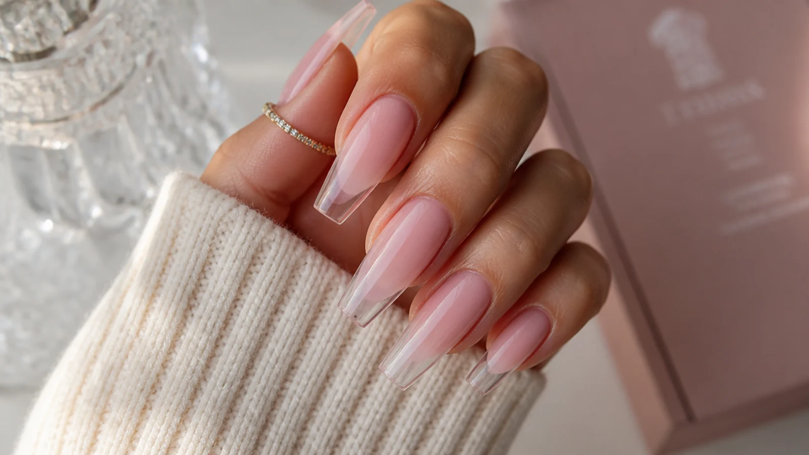 Translucent cotton candy pink jelly coffin nails with the natural nail visible through the tip