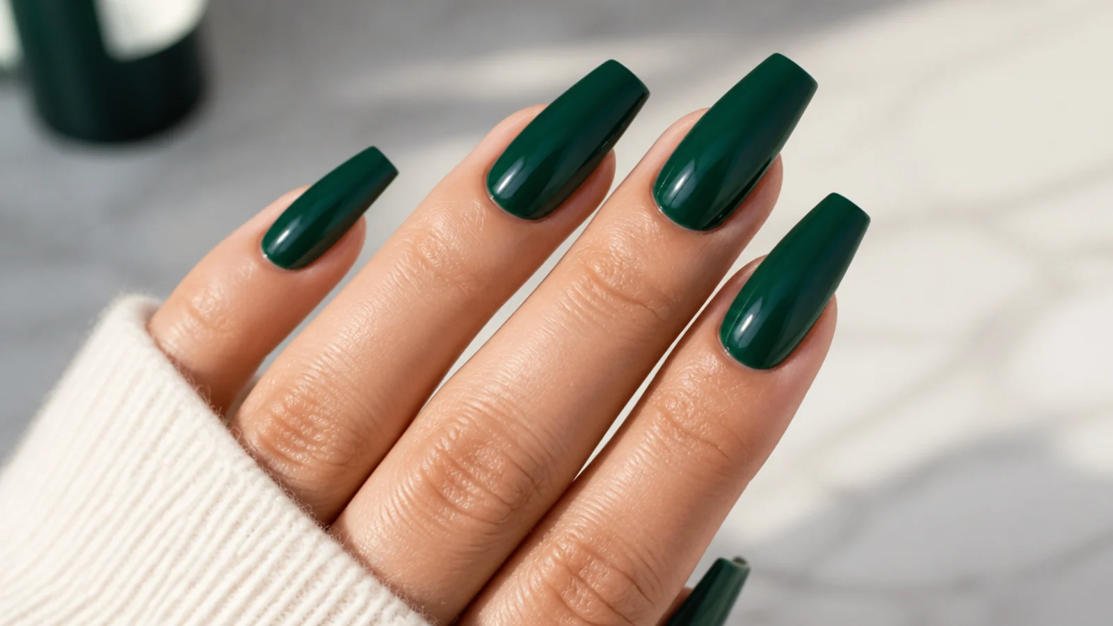 Long emerald green coffin nails with a jewel-toned glossy finish