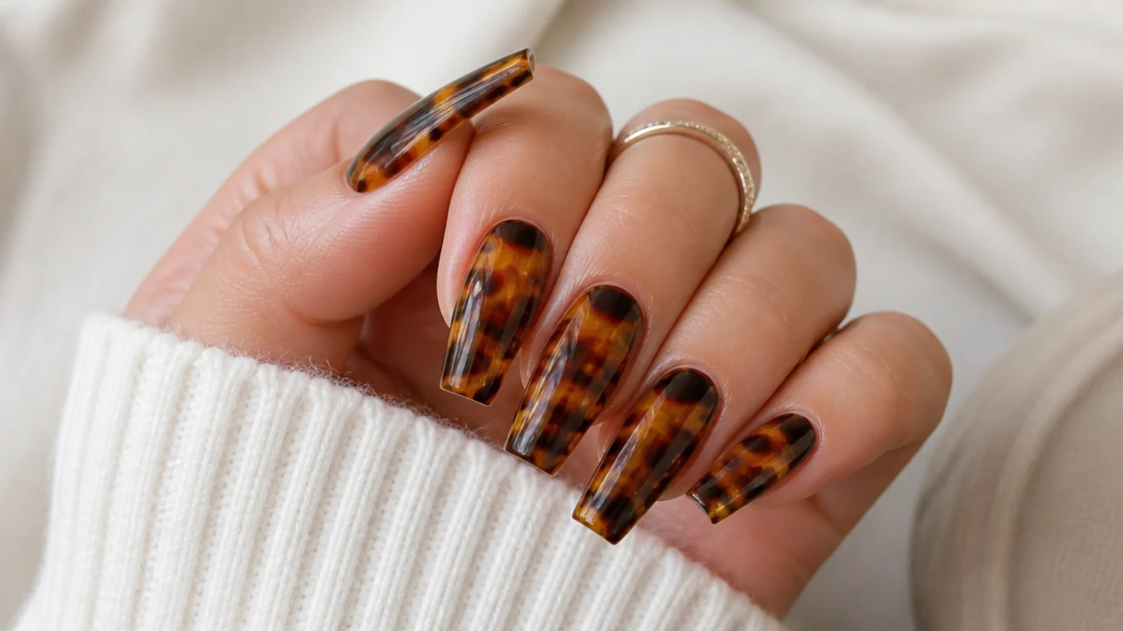 Amber and dark brown tortoiseshell coffin nails with mottled water-marbled patches