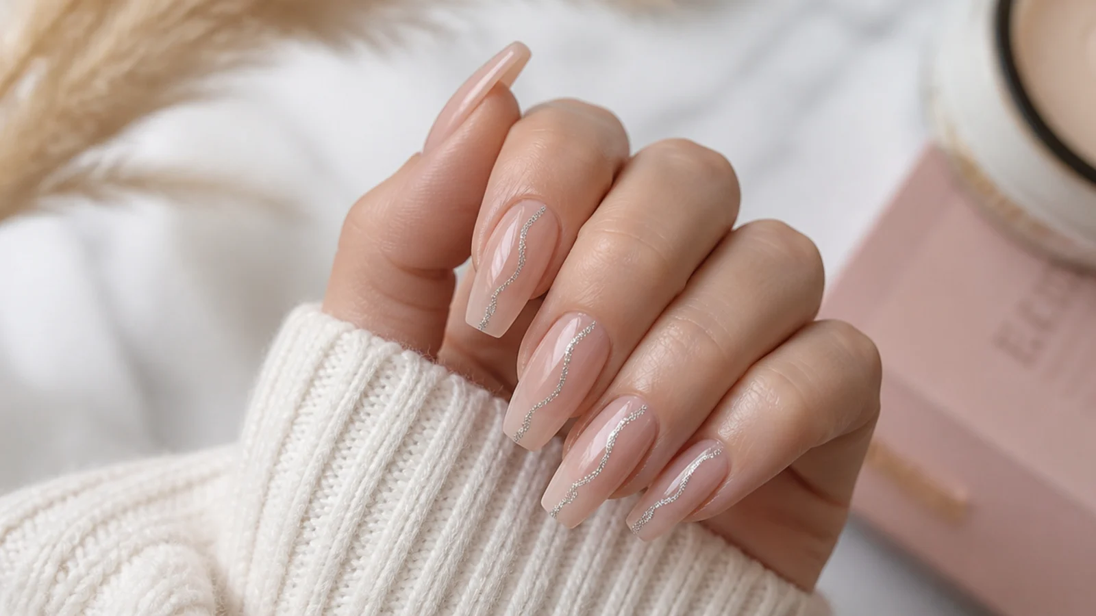 Sheer coffin nails with a single wavy silver glitter line running the length of the nail