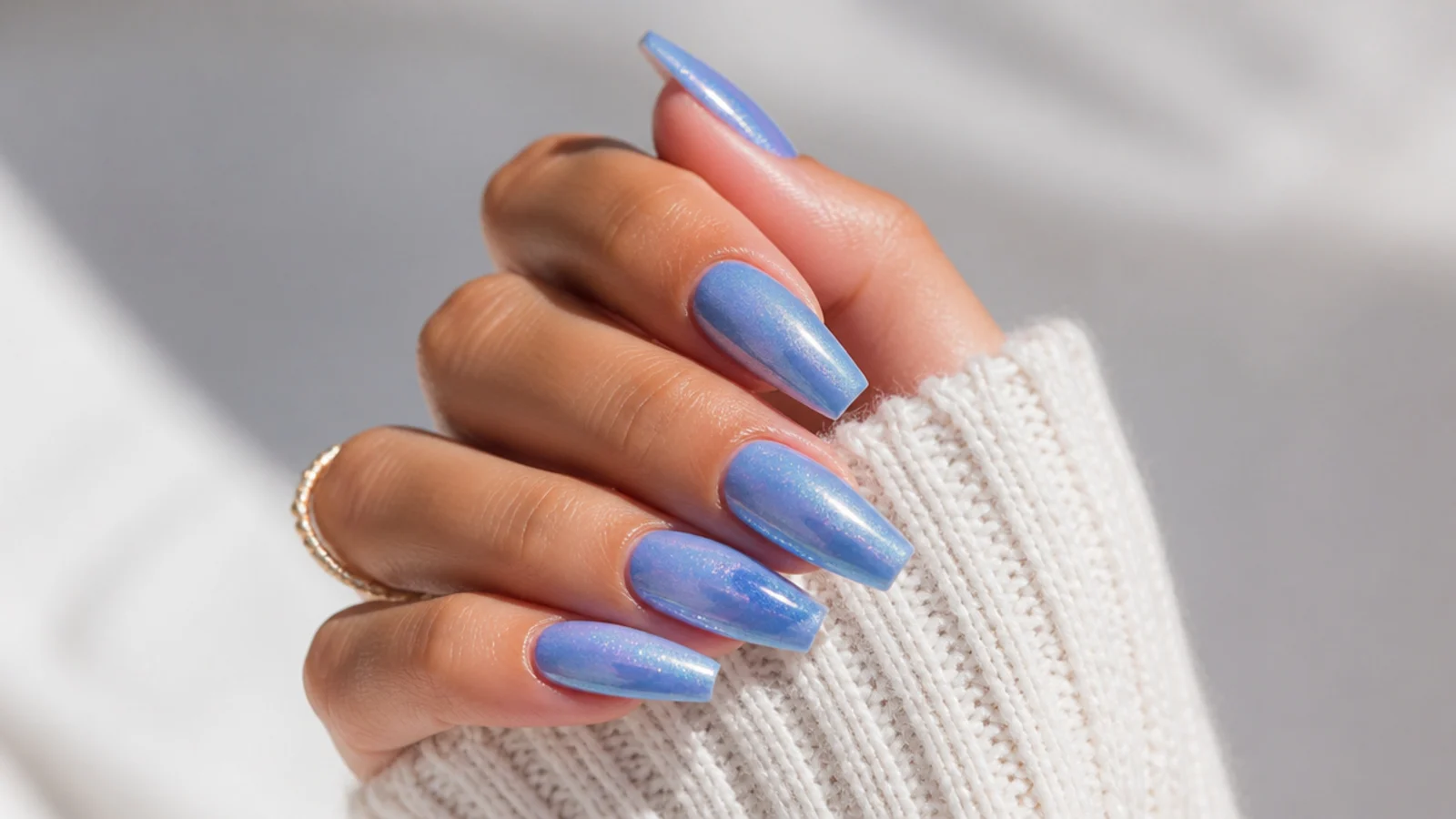 Long coffin nails in periwinkle blue with a soft chrome shimmer