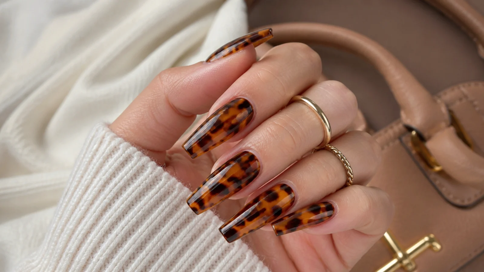 Long coffin nails in amber tortoiseshell with dark brown mottled patches